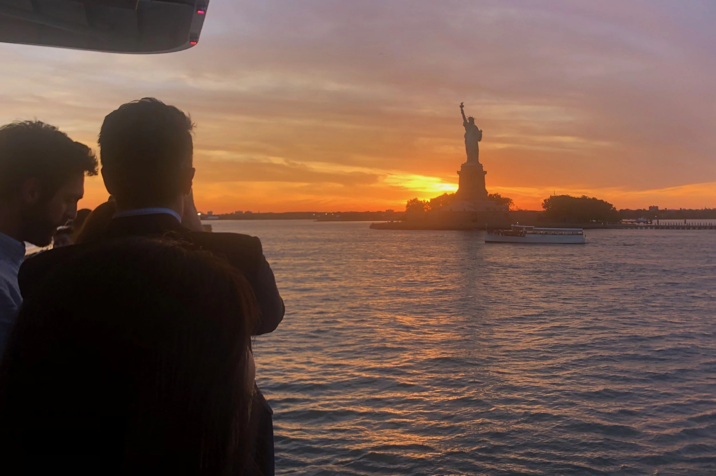 Scenic sunset skyline cruise near Statue of Liberty