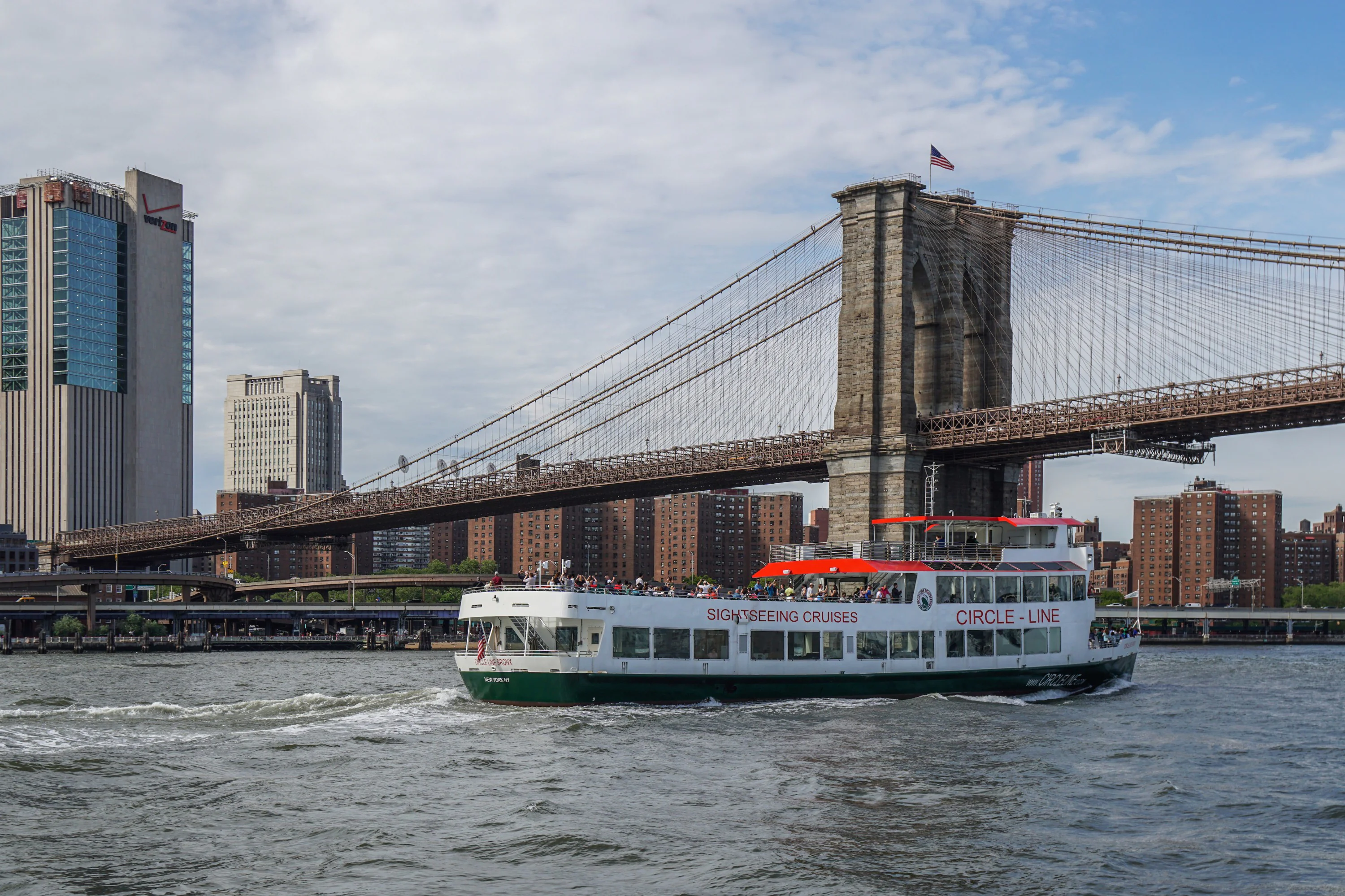 Circle Line cruise passing under Brooklyn Bridge in New York